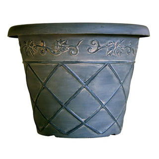 Decorative pot with embossed patterns on a white background