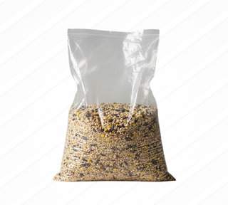 Clear bag filled with birdseed on a white background