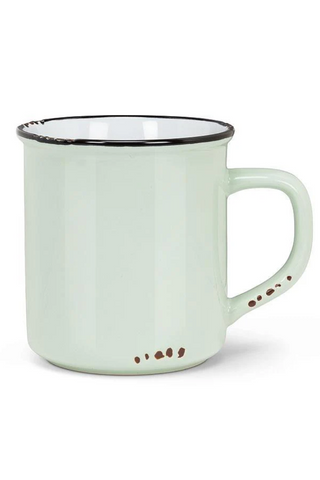 Light green mug with black rim and brown speckles on a white background
