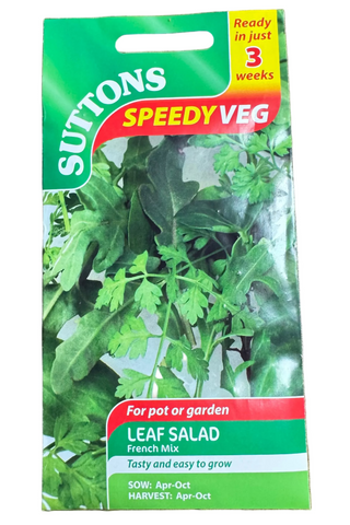 Suttons Speedy Veg leaf salad seed packet on a wooden surface