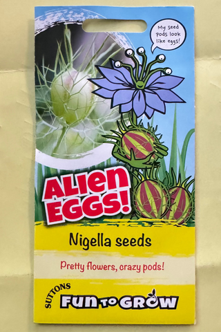 Packaging of Alien Eggs Nigella seeds with colorful design on a beige background