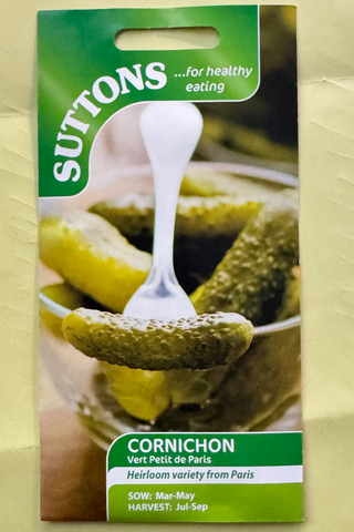 Suttons cornichon seed packet on a textured beige background