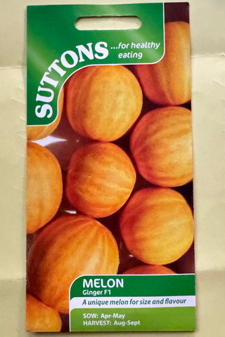 Suttons melon seed packet on a textured beige background