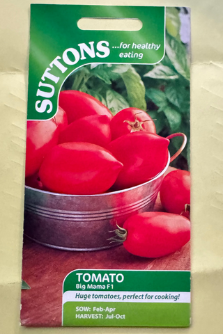Suttons tomato seed packet on a textured beige background