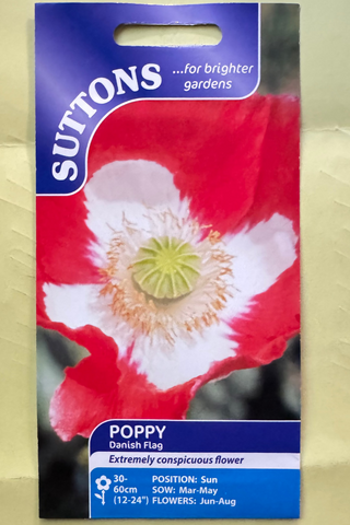 Suttons poppy seed packet on a beige background
