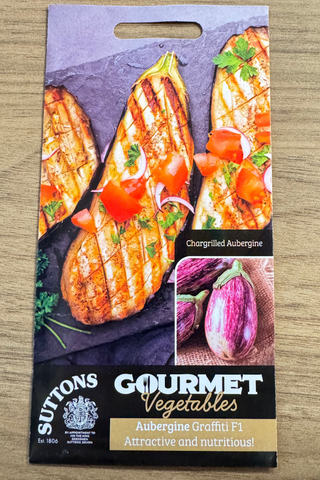 Suttons Gourmet Vegetables packaging with grilled aubergine on a wooden surface