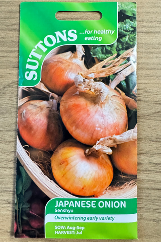 Suttons Japanese onion seed packet on a wooden surface