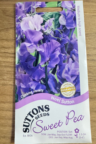 Suttons Seeds sweet pea packet on a wooden surface