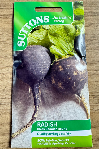 Suttons radish seed packet on a wooden surface