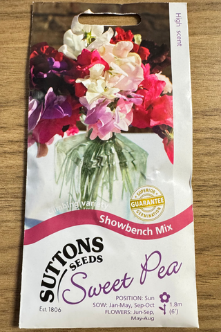 Suttons Seeds Sweet Pea packaging on a wooden surface