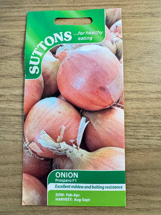 Suttons onion seed packet on a wooden surface