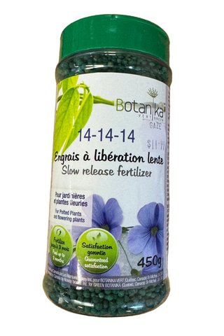 A container of Botanika slow release fertilizer for potted plants, with a label indicating the product is enriched with magnesium, phosphorus, and potassium, and that it is a 450g container.