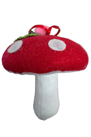 Red and white mushroom-shaped plush toy on a white background