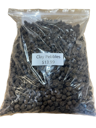 A clear plastic bag filled with black clay pebbles, with a label that indicates the product is 'Clay Pebbles' and priced at $13.99.