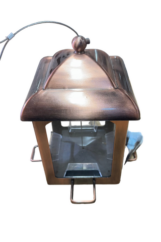 Metallic outdoor light fixture on a white background