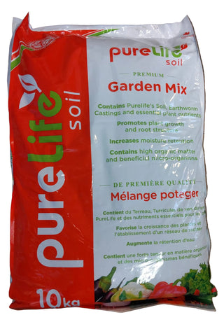 Bag of Pure Life soil garden mix on a wooden surface