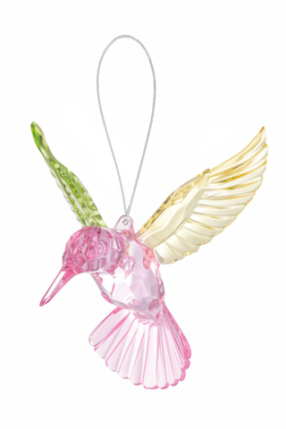 Decorative hummingbird ornament with pink body and gold wings on a white background