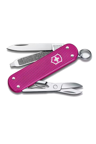 Pink Swiss Army knife with tools on a white background