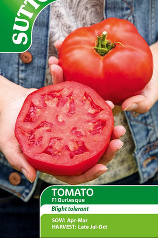 Suttons tomato seed packet with a person holding a tomato