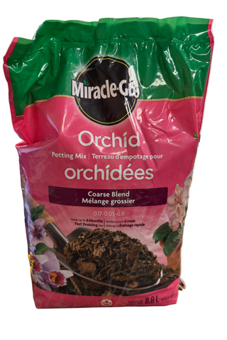 A bag of Miracle Gro orchid potting mix, 8.8L, with a green and pink color scheme.