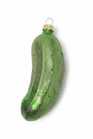 Green glittery cucumber-shaped ornament on a white background